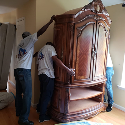 OCL Moving Inc. moving an Armoire